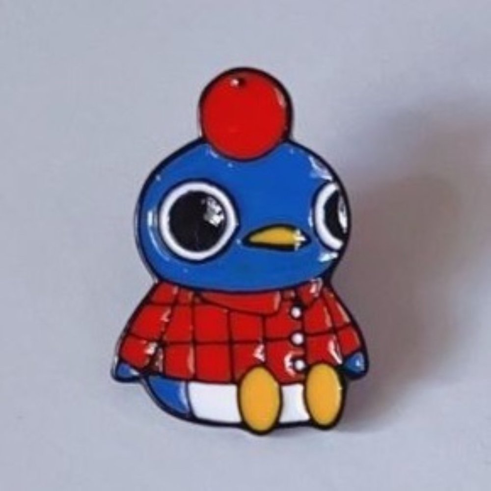 Penguin lumberjack pin orange enamel blue